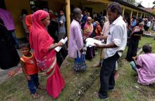 Villagers wait outside the National Register of Citizens (NRC) centre to get their documents verified by government officials, at Mayong Village in Morigaon district, in the northeastern state of Assam, India July 8, 2018. PHOTO BY REUTERS/Anuwar Hazarika