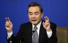 Chinese Foreign Minister Wang Yi gestures as he speaks at a news conference at the annual session of the National People's Congress (NPC), the country's parliament, in Beijing, March 8, 2015. PHOTO BY REUTERS/Stringer