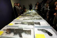 Air rifles seized along with explosives are displayed during a news conference at police headquarters in Hong Kong, China June 15, 2015. PHOTO BY REUTERS/Bobby Yip