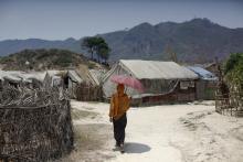 A Rohingya woman walks at the Kyein Ni Pyin camp for internally displaced people in Pauk Taw, Rakhine state