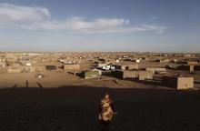 An indigenous Sahrawi woman walks at a refugee camp of Boudjdour in Tindouf, southern Algeria, March 3, 2016. PHOTO BY REUTERS/Zohra Bensemra