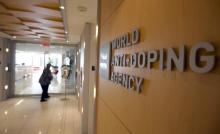 A woman walks into the head office for the World Anti-Doping Agency (WADA) in Montreal, November 9, 2015. PHOTO BY REUTERS/Christinne Muschi