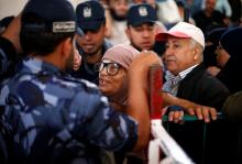 A woman asks for a travel permit to cross into Egypt through the Rafah border crossing after it was opened for two days by Egyptian authorities, in the southern Gaza Strip, May 11, 2016. PHOTO BY REUTERS/Suhaib Salem