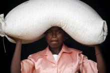 A woman carries food aid distributed by the United Nations World Food Progamme (WFP) in Mzumazi village near the capital Lilongwe, Malawi, February 3, 2016. PHOTO BY REUTERS/Mike Hutchings