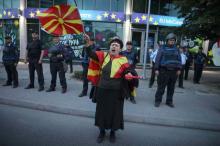 A woman sings Macedonian national anthem during the demonstrations in front of the EU Info Center building in Skopje, Macedonia, April 28, 2017. PHOTO BY REUTERS/Stoyan Nenov