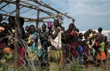 South Sudanese women and children queue to receive emergency food at the United Nations protection of civilians (POC) site 3 hosting about 30,000 people displaced during fighting in Juba, South Sudan, July 25, 2016. PHOTO BY REUTERS/Adriane Ohanesian
