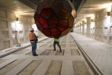 Labourers work with a large light fixture as they continue construction on a new underground cemetery, located at Givat Shaul Cemetery in Jerusalem, October 6, 2019. PHOTO BY REUTERS/Ammar Awad