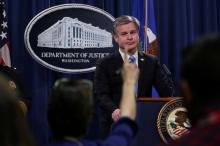 FBI Director Christopher Wray answers questions from reporters during a news conference at the Justice Department in Washington, U.S., October 26, 2018. PHOTO BY REUTERS/Jonathan Ernst