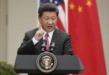 Chinese President Xi Jinping addresses a joint news conference with U.S. President Barack Obama in the Rose Garden at the White House in Washington, September 25, 2015. PHOTO BY REUTERS/Gary Cameron