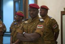 Burkina Faso Prime minister Yacouba Isaac Zida stands as an official reads the names of transitional government ministers in Ouagadougou, November 23, 2014. PHOTO BY REUTERS/Joe Penney