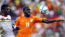 Yaya Toure of Ivory Coast is challenged by Guinea's Kevin Constant during their Group D soccer match of the 2015 African Cup of Nations in Malabo, January 20, 2015. PHOTO BY REUTERS/Amr Abdallah Dalsh