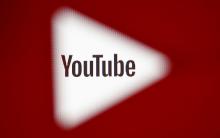 A 3D-printed YouTube icon is seen in front of a displayed YouTube logo in this illustration taken October 25, 2017. BY REUTERS/Dado Ruvic/Ilustration