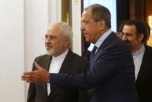 Russian Foreign Minister Sergei Lavrov (R) shows the way to his Iranian counterpart Mohammad Javad Zarif as they enter a hall during their meeting in Moscow, Russia, August 17, 2015. PHOTO BY REUTERS/Maxim Zmeyev