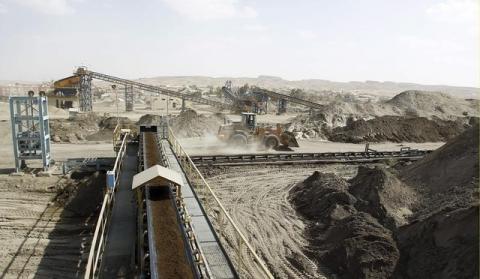 A bulldozer works at a phosphate mines in Metlaoui, Tunisia, April 6, 2012. PHOTO BY REUTERS/Zoubeir Souissi