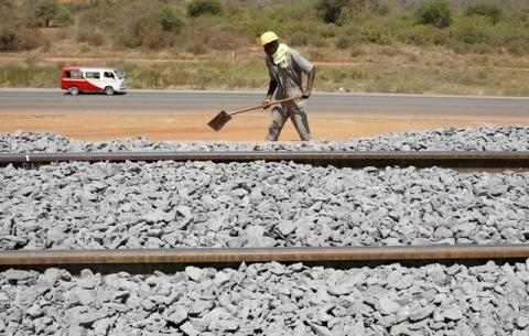 A construction worker works on the new standard gauge railway line near Voi town, Kenya, March 16, 2016. PHOTO BY REUTERS/Goran Tomasevic