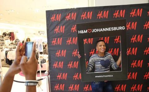 A customer is photographed outside the H&M shop at a mall in Midrand outside Johannesburg, South Africa, April 28,2016. PHOTO BY REUTERS/Siphiwe Sibeko