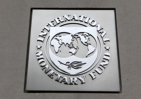 The International Monetary Fund (IMF) logo is seen at the IMF headquarters building during the 2013 Spring Meeting of the International Monetary Fund and World Bank in Washington, April 18, 2013. PHOTO BY REUTERS/Yuri Gripas