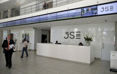 People walk near the reception at the Johannesburg Stock Exchange (JSE) in Sandton, Johannesburg, South Africa, December 10, 2015. PHOTO BY REUTERS/Siphiwe Sibek