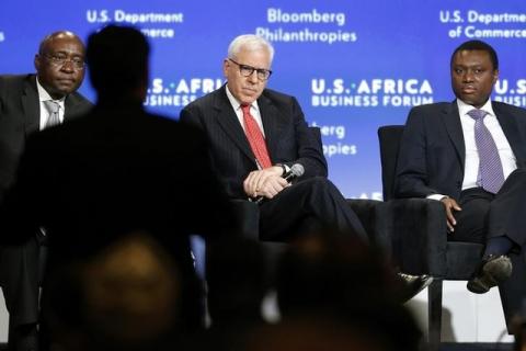 Donald Kaberuka (L) takes a question from the audience as he leads a panel discussion including Carlyle Group CEO (C) and Standard Bank Chief Executive Sim Tshabalala (R) during the U.S.-Africa Business Forum in Washington, August 5, 2014. PHOTO BY REUTERS/Jonathan Ernst