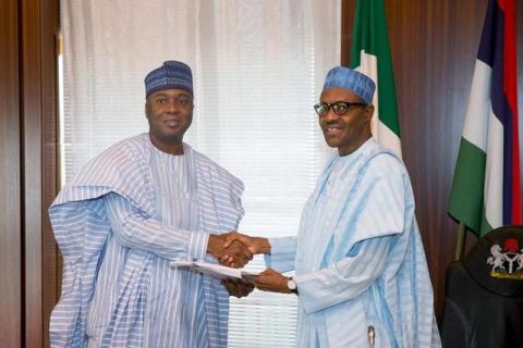 Nigeria's President Muhammadu Buhari (R) receive a letter of confirmation from the President of the Senate of Nigeria Bukola Saraki in Abuja, Nigeria, November 3, 2015. PHOTO BY REUTERS/Stringer