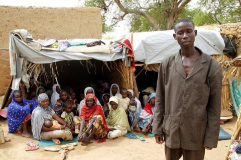 Aba Ali, a Nigerian refugee who fled from his village in northeastern Nigeria into Niger following Boko Haram attacks, stands next to his relatives at the home of Adamu Moumouni, his Nigerien host who took them in, in Diffa in southeastern Niger, June 21, 2016. PHOTO BY REUTERS/Luc Gnago