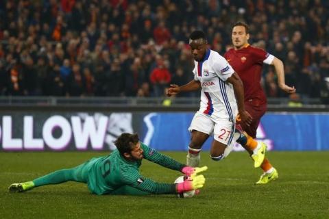 Lyon's Maxwel Cornet in action with Roma's Alisson Becker. PHOTO BY REUTERS/Tony Gentile Livepic