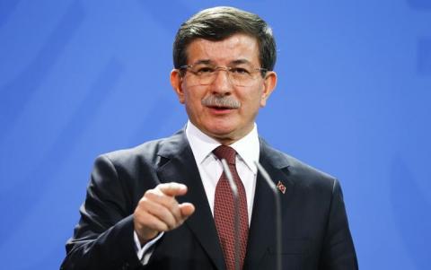 Turkish Prime Minister Ahmet Davutoglu speaks to media after his meeting with German Chancellor Angela Merkel at the Chancellery in Berlin, January 12, 2015. PHOTO BY REUTERS/Hannibal Hanschke