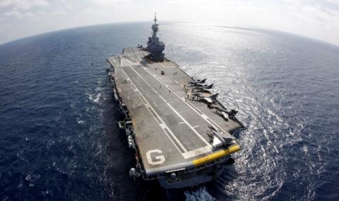 France's flagship Charles de Gaulle aircraft carrier patrols in the Mediterranean, March 26, 2011. PHOTO BY REUTERS/Benoit Tessier