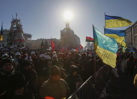 KIEV (Reuters) - Ukrainian President Viktor Yanukovich returned to his desk on Monday after four days of sick leave, while the political opposition pressed for further concessions from him to end more than two months of street protests against his rule. "He is back at work," a presidential spokesman said. Yanukovich is seeking a way out of a confrontation with thousands of protesters who have seized control of Kiev's city center in a conflict which has at times flared into violent clashes between radicals