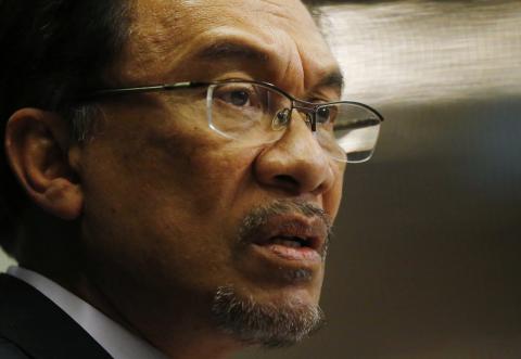 Malaysia's opposition leader Anwar Ibrahim speaks to the media ahead of the verdict in his final appeal against a conviction for sodomy in Kuala Lumpur, February 4, 2015. PHOTO BY REUTERS/Olivia Harris