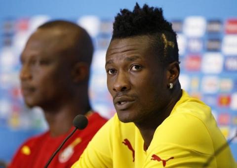 Ghana national soccer team captain Asamoah Gyan (R) speaks next to team coach James Kwesi Appiah during a news conference before their training session at the Dunas Arena soccer stadium in Natal June 15, 2014. Ghana will face United States on June 16. PHOTO BY REUTERS/Toru Hanai