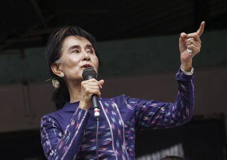 Myanmar pro-democracy leader Aung San Suu Kyi gives speech during her during her door-to-door visits for voter education campaign at Warheinkha village in her constituency town Khawhmu, outside Yangon, July 4, 2015. PHOTO BY REUTERS/Soe Zeya Tun