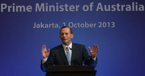 Australia's Prime Minister Tony Abbott speaks at a breakfast meeting in Jakarta