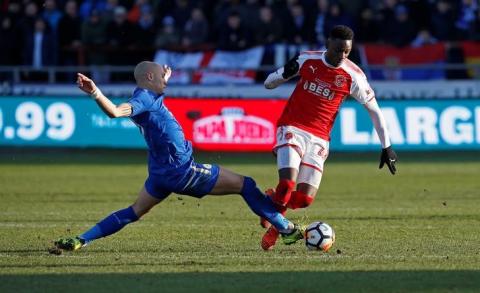 Fleetwood Town’s Devante Cole in action with Leicester City's Yohan Benalouane. PHOTO BY REUTERS/Craig Brough