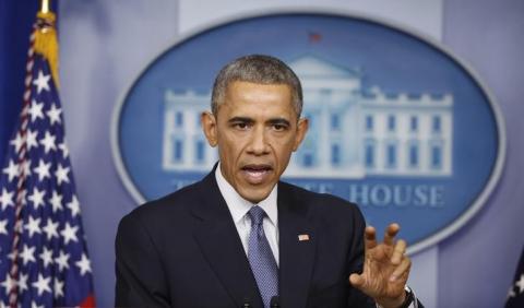 U.S. President Barack Obama answers a question about the cyberattack on Sony Pictures after his end of the year press conference in the briefing room of the White House in Washington, December 19, 2014. PHOTO BY REUTERS/Larry Downing