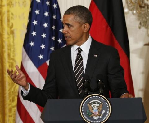 U.S. President Barack Obama speaks during a joint news conference with German Chancellor Angela Merkel in the East Room of the White House in Washington, February 9, 2015. PHOTO BY REUTERS/Kevin Lamarque