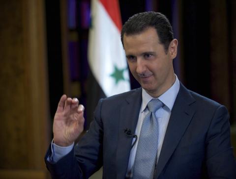 Syria's President Bashar al-Assad is seen during the filming of an interview with the BBC, in Damascus, February 9, 2015. PHOTO BY REUTERS/SANA