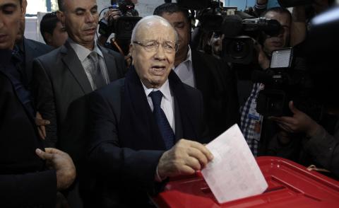 Beji Caid Essebsi, leader of Tunisia's secular Nidaa Tounes party and a presidential candidate, casts his vote at a polling station in Tunis, November 23, 2014. PHOTO BY REUTERS/Zoubeir Souissi