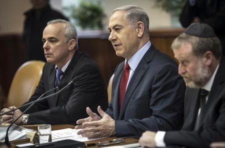 Israel's Prime Minister Benjamin Netanyahu (C) and Strategic Affairs Minister Yuval Steinitz (L) attend the weekly cabinet meeting in Jerusalem, December 14, 2014. PHOTO BY REUTERS/Oliver Weiken