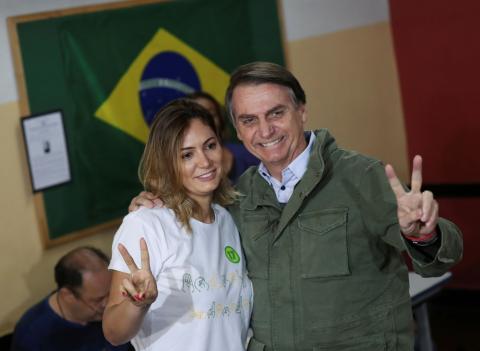 Jair Bolsonaro, far-right lawmaker and presidential candidate of the Social Liberal Party (PSL), poses with his wife Michelle as they arrive to cast their votes, at a polling centre in Rio de Janeiro, Brazil, October 28, 2018. PHOTO BY REUTERS/Ricardo Moraes