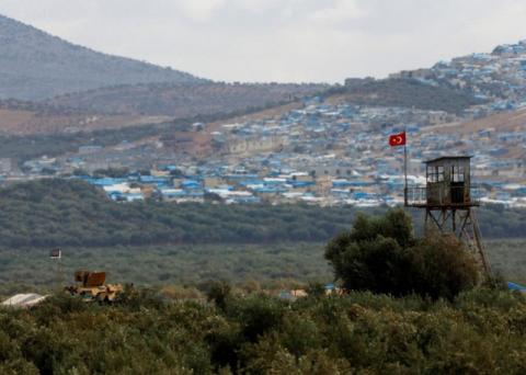 A Turkish military armoured vehicle guards on the border line located opposite the Syrian town of Atimah, Idlib province, in this picture taken from Reyhanli, Hatay province, Turkey, October 10, 2017. PHOTO BY REUTERS/Osman Orsal