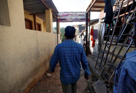 The father of a boy, who according to the father committed suicide after he was sexually assaulted last year, walks in an alley outside his house in Mumbai, India, April 26, 2018. PHOTO BY REUTERS/Francis Mascarenhas