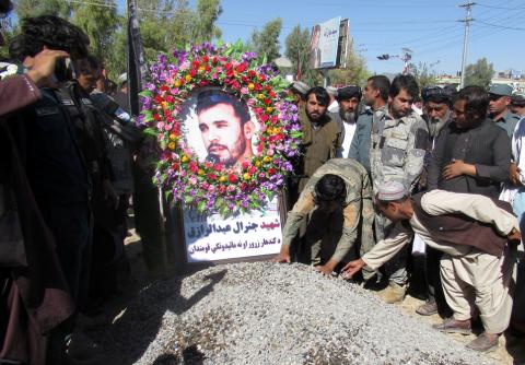 People attend a burial ceremony of General Abdul Razeq, the Kandahar police commander, who was killed in yesterday's attack, in Kandahar province, Afghanistan, October 19, 2018. PHOTO BY REUTERS/Ismail Sameem