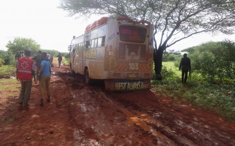 Rescue workers walk near a Nairobi-bound bus that was ambushed outside Mandera town, near Kenya's border with Somalia and Ethiopia, November 22, 2014. PHOTO BY REUTERS/Stringer