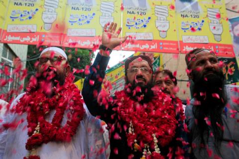 Mohammad Yaqoob Sheikh (C) nominated candidate of political party Milli Muslim League (MML), waves to his supporters during an election campaign for the National Assembly NA-120 constituency in Lahore, Pakistan, September 9, 2017. PHOTO BY REUTERS/Mohsin Raza
