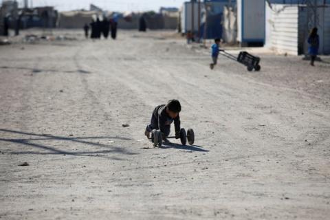 A displaced Iraqi boy plays at the Amriyat al Fallujah camp in Anbar Province, Iraq, January 3, 2018. PHOTO BY REUTERS/Khalid al-Mousily