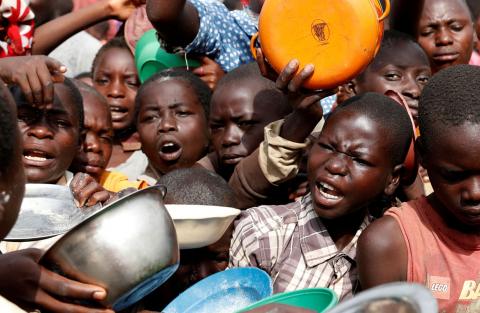 Internally displaced people wait for food distribution at an internally displaced persons (IDP) camp in Bunia, Ituri province, eastern Democratic Republic of Congo, April 12, 2018. PHOTO BY REUTERS/Goran Tomasevic