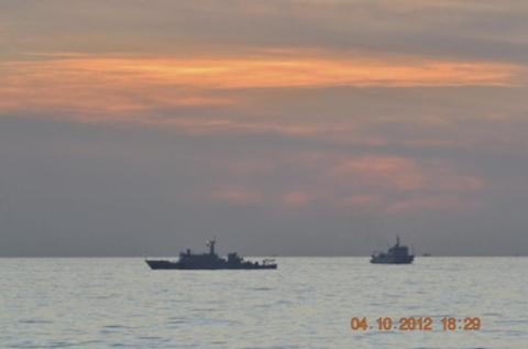 A handout photo shows two Chinese surveillance ships which sailed between a Philippines warship and eight Chinese fishing boats to prevent the arrest of any fishermen in the Scarborough Shoal, a small group of rocky formations