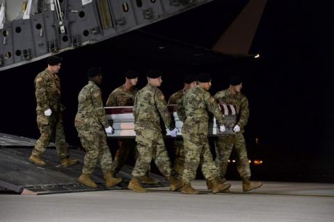A U.S. Army carry team transfers the remains of Army Staff Sgt. Dustin Wright of Lyons, Georgia, at Dover Air Force Base in Delaware, U.S. on October 5, 2017. PHOTO BY REUTERS/Courtesy Aaron J. Jenne/U.S. Air Force