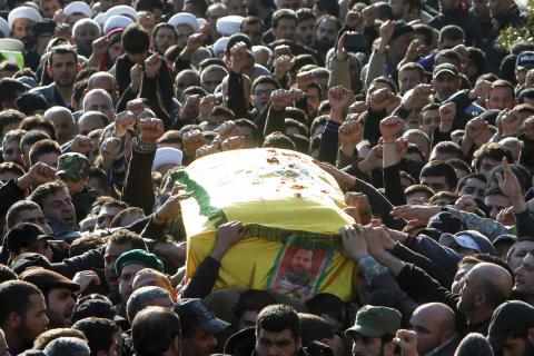 Hezbollah members and supporters carry the coffin of Lebanon's Hezbollah commander Mohamad Issa, known as Abu Issa, during his funeral in Arab-Salim, south Lebanon, January 20, 2015. PHOTO BY REUTERS/Ali Hashisho